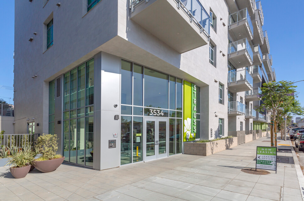 Exterior entrance of Strauss on Fifth, a modern apartment community located in San Diego, California.