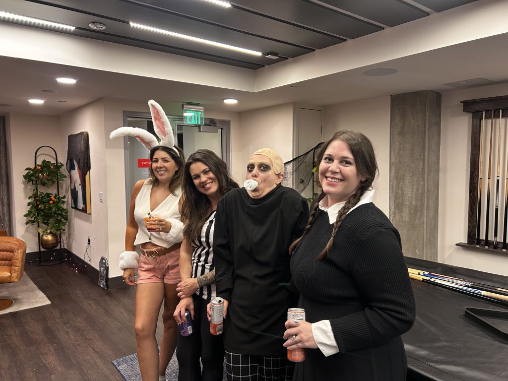Residents and team members during a Strat Property Management Halloween apartment community event in 2025