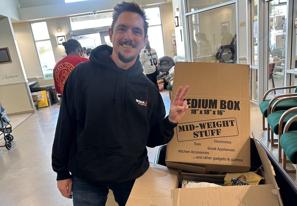SPMI team member at Pet Drive Donations 2025.