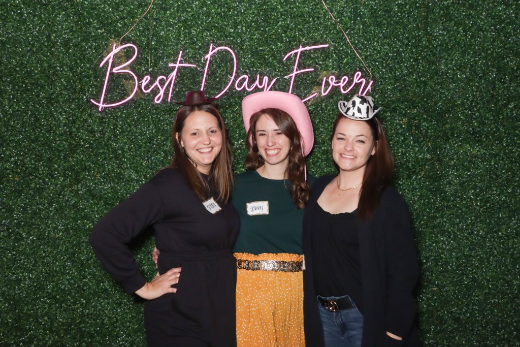 Tristina, Ashley, and Diana at the Strat Property Management team member dinner in 2023