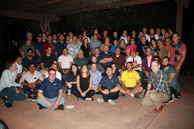 Strat Property Management team members wearing Stratitude shirts during a community volunteer event.